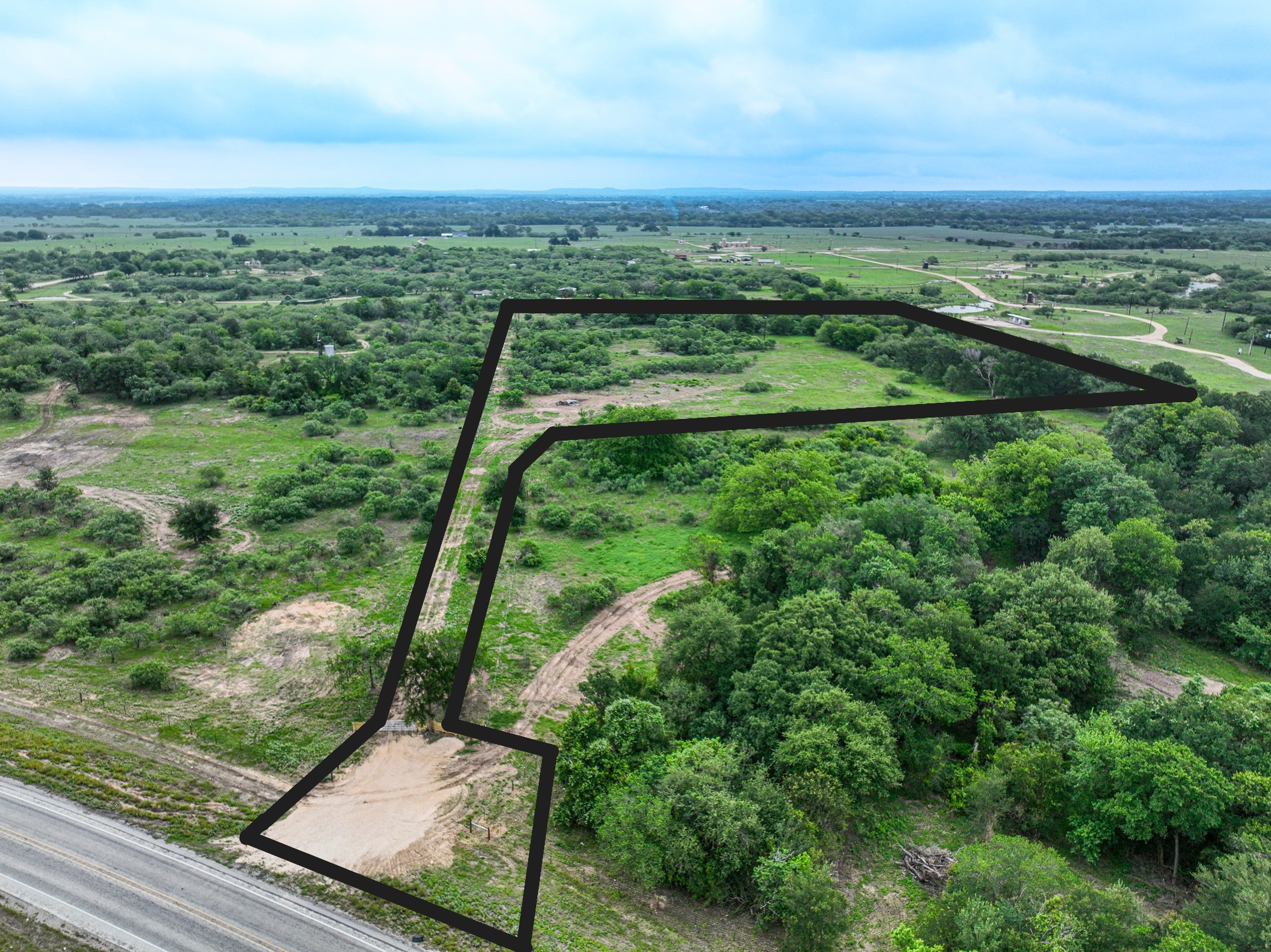 Discover a stunning piece of Central Texas landscape located in Luling, TX. This property offers over 13+ acres of land, providing the perfect blend of country living and convenience. Enjoy the serene environment, just minutes from town, while experiencing true rural tranquility. The land boasts enormous shade trees and beautiful creek bottom terrain. Its gentle, sloping topography offers pristine views of the surrounding countryside, making it an ideal spot for those seeking scenic vistas. West Plum Creek runs along the backside of the property, adding to its natural appeal. The property features FM highway frontage, ensuring easy access. Several prime building sites are ready for development, with new fencing and electricity already installed. These improvements make the land immediately usable for various purposes. Situated within 5 minutes of Luling and just 10 minutes from Lockhart, this property provides quick access to nearby towns. It is less than an hour from both Austin and San Antonio, and only about 45 minutes from the Austin International Airport and Circuit of the Americas racetrack. 
NO RESTRICTIONS
AG EXEMPT - WILDLIFE