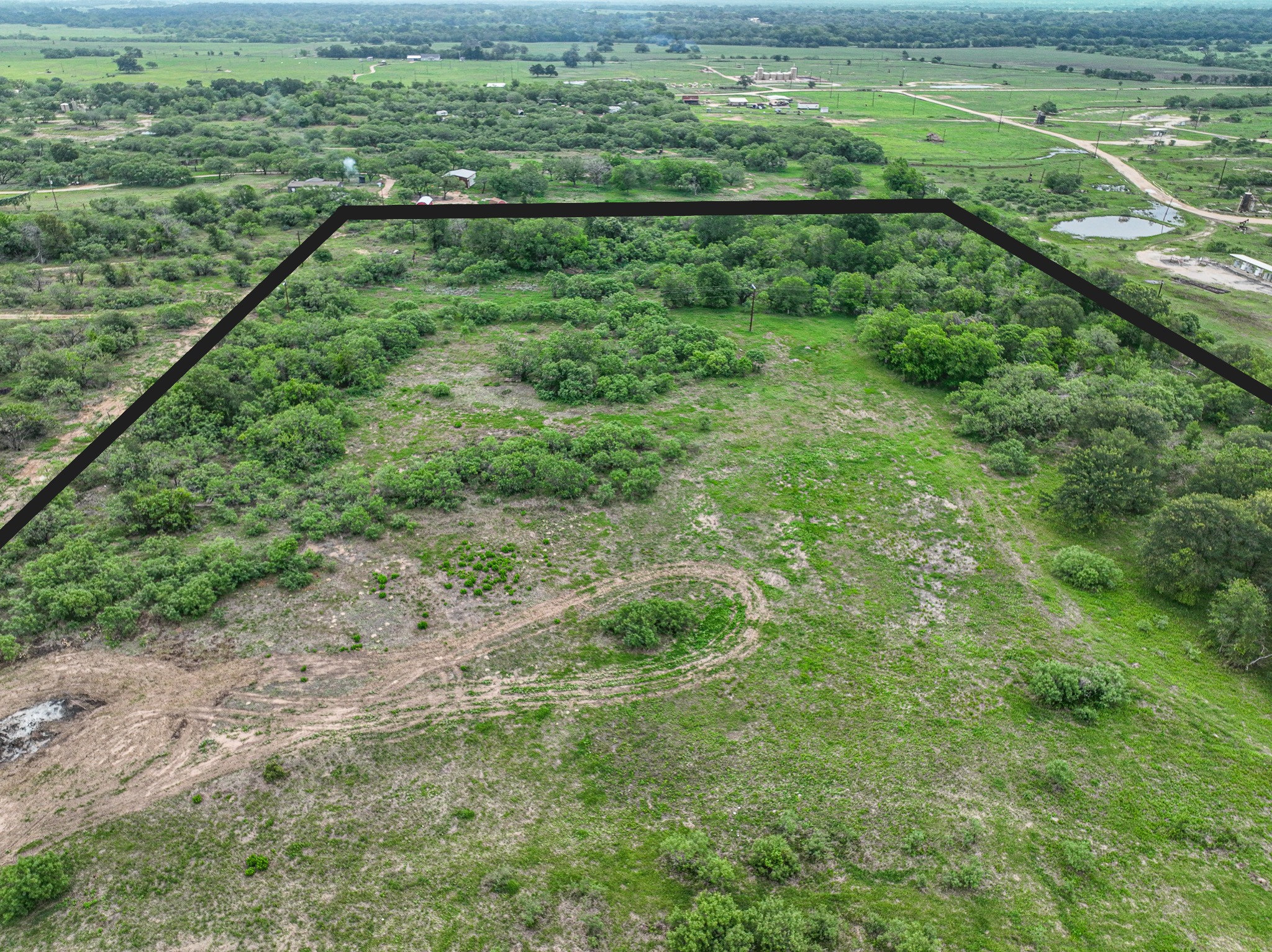 Discover a stunning piece of Central Texas landscape located in Luling, TX. This property offers over 13+ acres of land, providing the perfect blend of country living and convenience. Enjoy the serene environment, just minutes from town, while experiencing true rural tranquility. The land boasts enormous shade trees and beautiful creek bottom terrain. Its gentle, sloping topography offers pristine views of the surrounding countryside, making it an ideal spot for those seeking scenic vistas. West Plum Creek runs along the backside of the property, adding to its natural appeal. The property features FM highway frontage, ensuring easy access. Several prime building sites are ready for development, with new fencing and electricity already installed. These improvements make the land immediately usable for various purposes. Situated within 5 minutes of Luling and just 10 minutes from Lockhart, this property provides quick access to nearby towns. It is less than an hour from both Austin and San Antonio, and only about 45 minutes from the Austin International Airport and Circuit of the Americas racetrack. 
NO RESTRICTIONS
AG EXEMPT - WILDLIFE