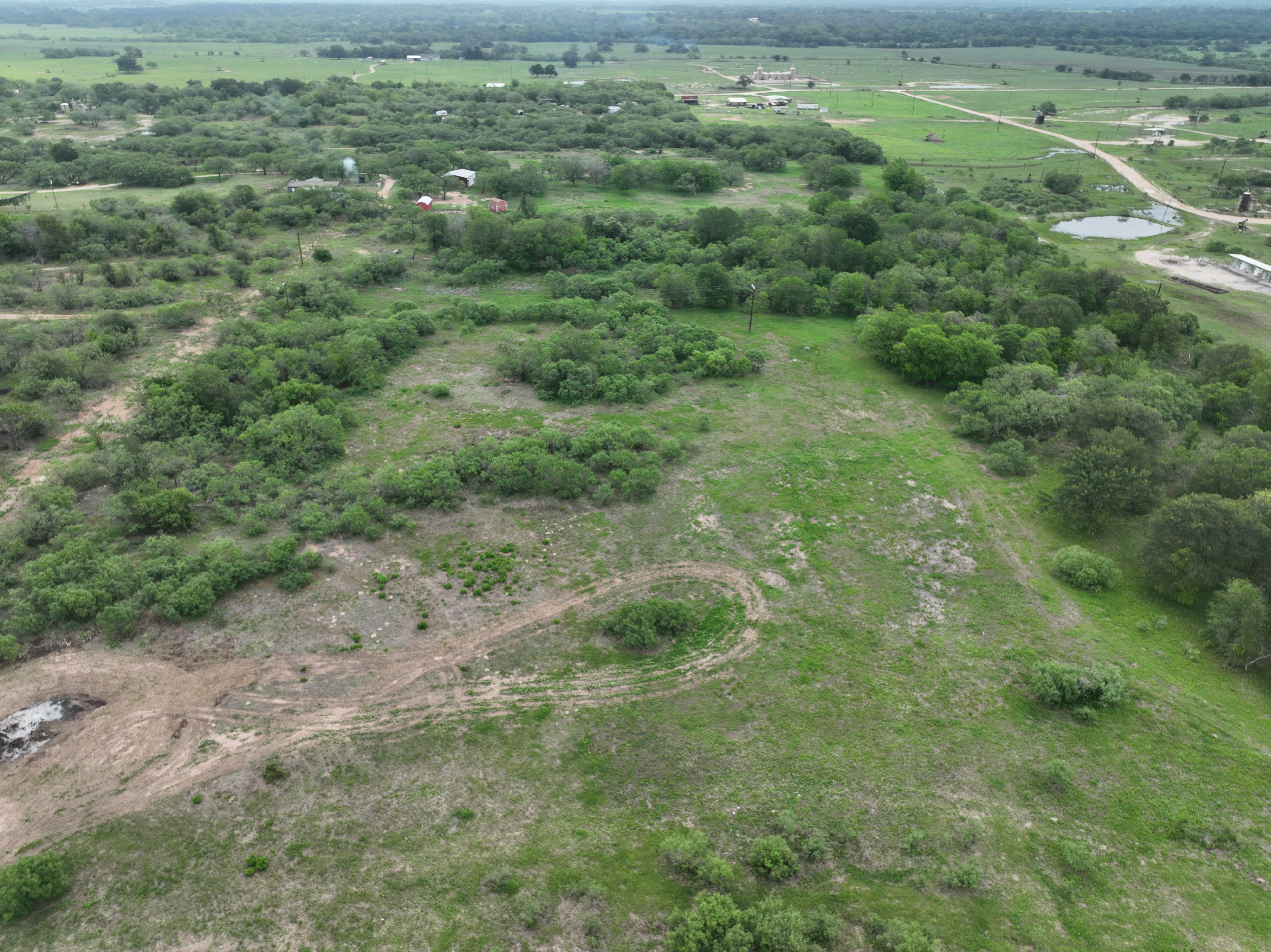 Discover a stunning piece of Central Texas landscape located in Luling, TX. This property offers over 13+ acres of land, providing the perfect blend of country living and convenience. Enjoy the serene environment, just minutes from town, while experiencing true rural tranquility. The land boasts enormous shade trees and beautiful creek bottom terrain. Its gentle, sloping topography offers pristine views of the surrounding countryside, making it an ideal spot for those seeking scenic vistas. West Plum Creek runs along the backside of the property, adding to its natural appeal. The property features FM highway frontage, ensuring easy access. Several prime building sites are ready for development, with new fencing and electricity already installed. These improvements make the land immediately usable for various purposes. Situated within 5 minutes of Luling and just 10 minutes from Lockhart, this property provides quick access to nearby towns. It is less than an hour from both Austin and San Antonio, and only about 45 minutes from the Austin International Airport and Circuit of the Americas racetrack. 
NO RESTRICTIONS
AG EXEMPT - WILDLIFE