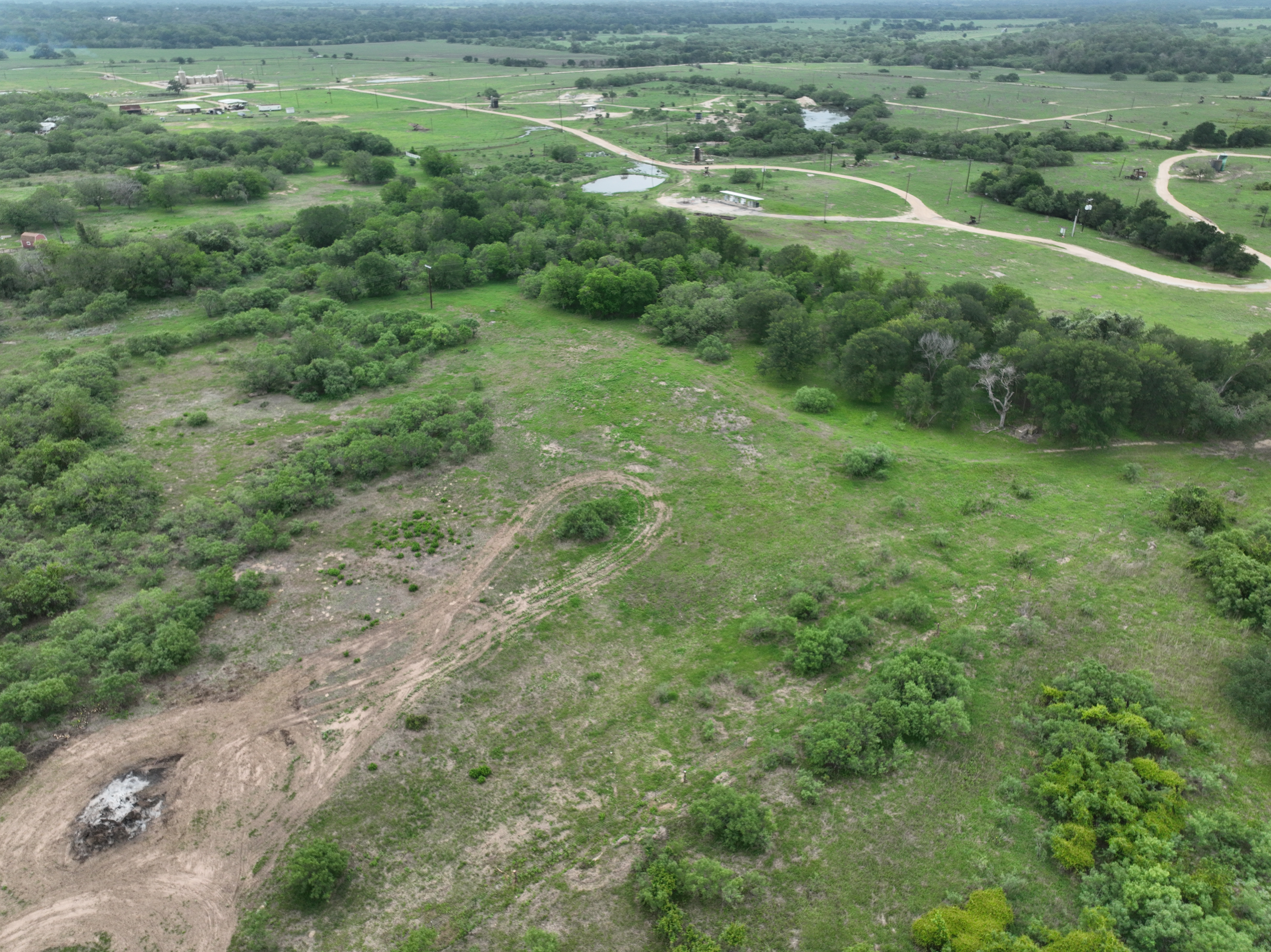 Discover a stunning piece of Central Texas landscape located in Luling, TX. This property offers over 13+ acres of land, providing the perfect blend of country living and convenience. Enjoy the serene environment, just minutes from town, while experiencing true rural tranquility. The land boasts enormous shade trees and beautiful creek bottom terrain. Its gentle, sloping topography offers pristine views of the surrounding countryside, making it an ideal spot for those seeking scenic vistas. West Plum Creek runs along the backside of the property, adding to its natural appeal. The property features FM highway frontage, ensuring easy access. Several prime building sites are ready for development, with new fencing and electricity already installed. These improvements make the land immediately usable for various purposes. Situated within 5 minutes of Luling and just 10 minutes from Lockhart, this property provides quick access to nearby towns. It is less than an hour from both Austin and San Antonio, and only about 45 minutes from the Austin International Airport and Circuit of the Americas racetrack. 
NO RESTRICTIONS
AG EXEMPT - WILDLIFE