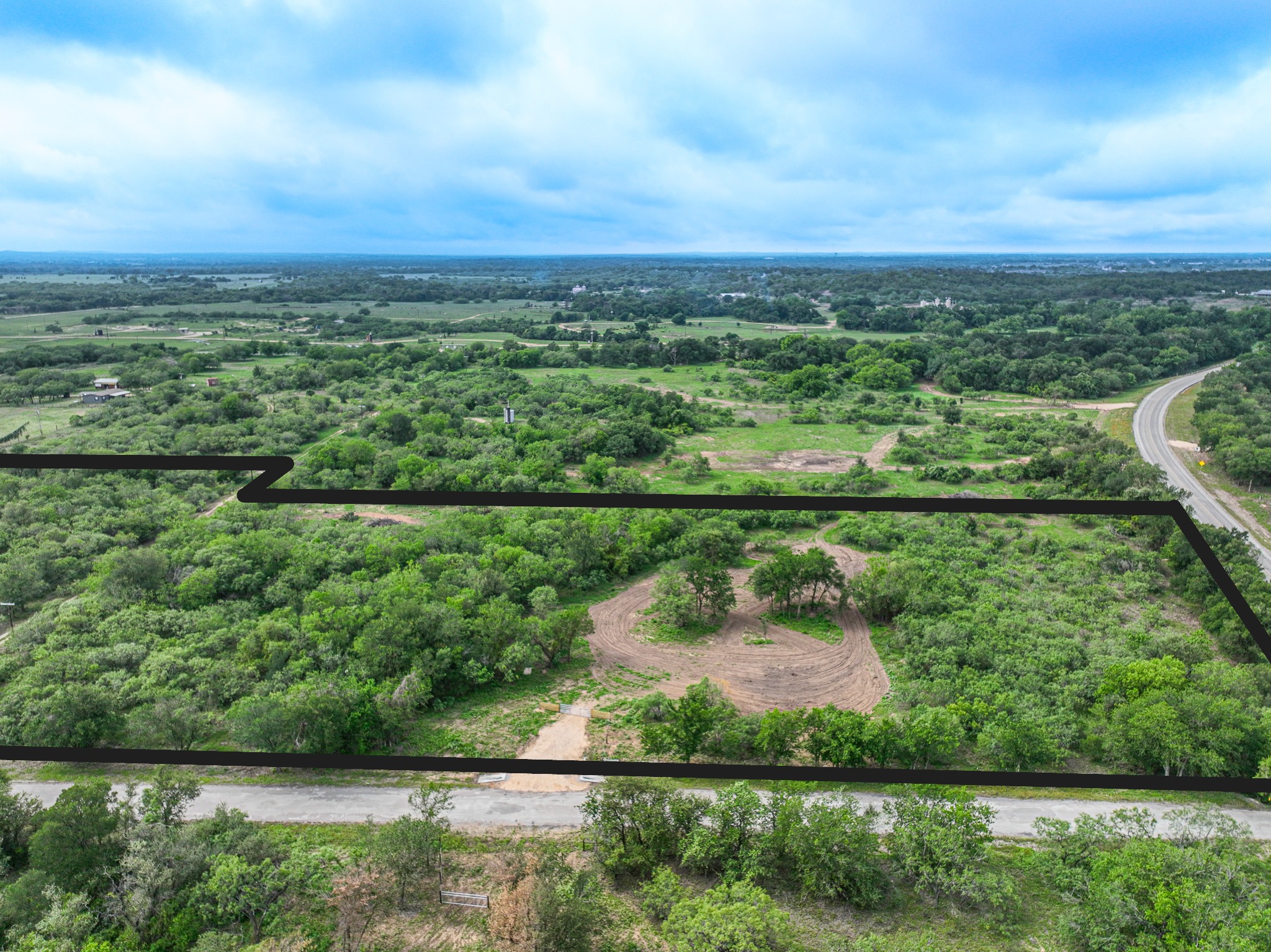 Discover a stunning piece of Central Texas landscape located in Luling, TX. This property offers over 12 acres of land, providing the perfect blend of country living and convenience. Enjoy the serene environment, just minutes from town, while experiencing true rural tranquility. The land boasts enormous shade trees and beautiful creek bottom terrain. Its gentle, sloping topography offers pristine views of the surrounding countryside, making it an ideal spot for those seeking scenic vistas. West Plum Creek runs along the backside of the property, adding to its natural appeal. The property features FM highway frontage, ensuring easy access. Several prime building sites are ready for development, with new fencing and electricity already installed. These improvements make the land immediately usable for various purposes. Situated within 5 minutes of Luling and just 10 minutes from Lockhart, this property provides quick access to nearby towns. It is less than an hour from both Austin and San Antonio, and only about 45 minutes from the Austin International Airport and Circuit of the Americas racetrack.
NO RESTRICTIONS
AG EXEMPT - WILDLIFE