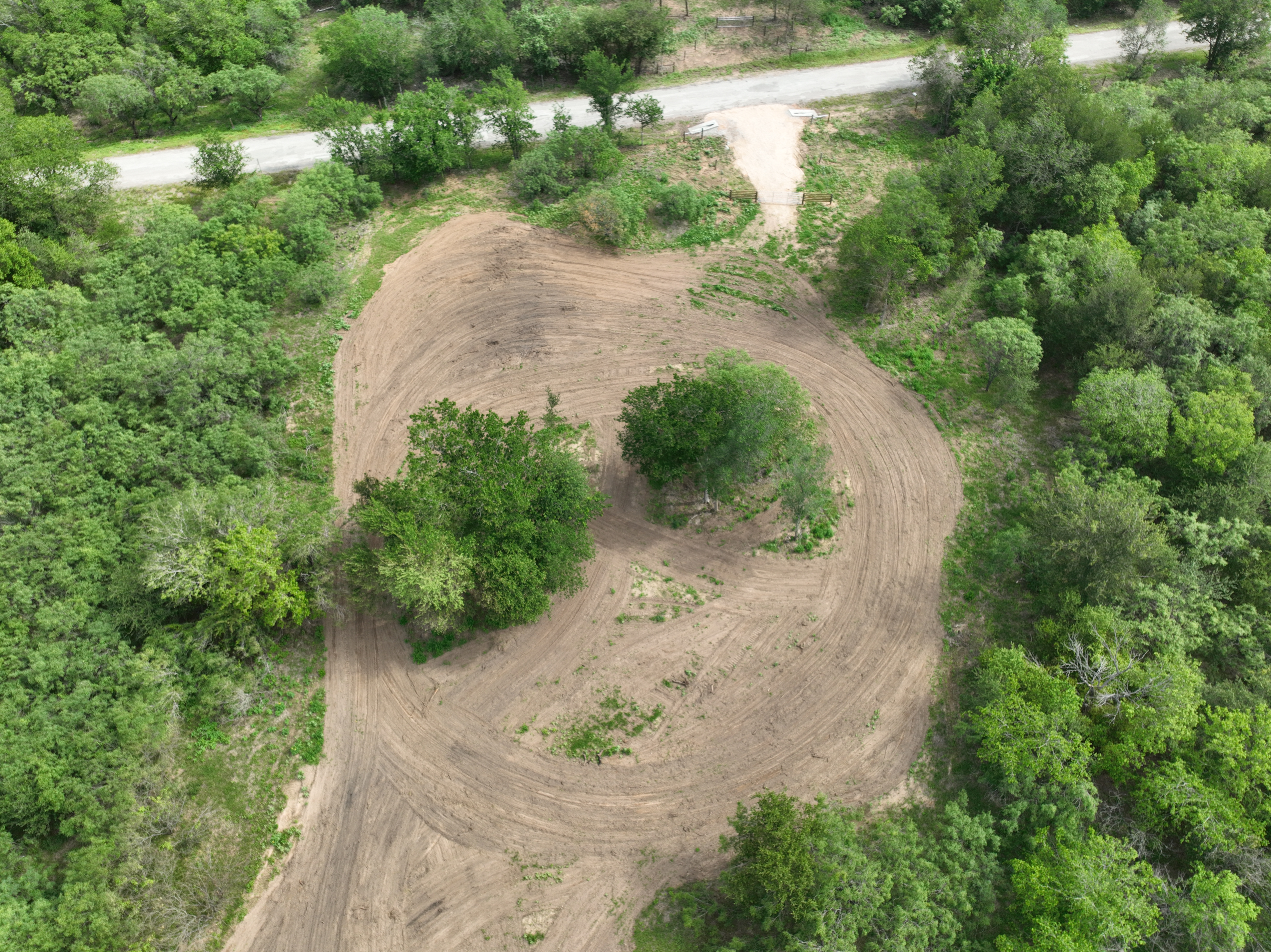 Discover a stunning piece of Central Texas landscape located in Luling, TX. This property offers over 12 acres of land, providing the perfect blend of country living and convenience. Enjoy the serene environment, just minutes from town, while experiencing true rural tranquility. The land boasts enormous shade trees and beautiful creek bottom terrain. Its gentle, sloping topography offers pristine views of the surrounding countryside, making it an ideal spot for those seeking scenic vistas. West Plum Creek runs along the backside of the property, adding to its natural appeal. The property features FM highway frontage, ensuring easy access. Several prime building sites are ready for development, with new fencing and electricity already installed. These improvements make the land immediately usable for various purposes. Situated within 5 minutes of Luling and just 10 minutes from Lockhart, this property provides quick access to nearby towns. It is less than an hour from both Austin and San Antonio, and only about 45 minutes from the Austin International Airport and Circuit of the Americas racetrack. 
NO RESTRICTIONS
AG EXEMPT - WILDLIFE