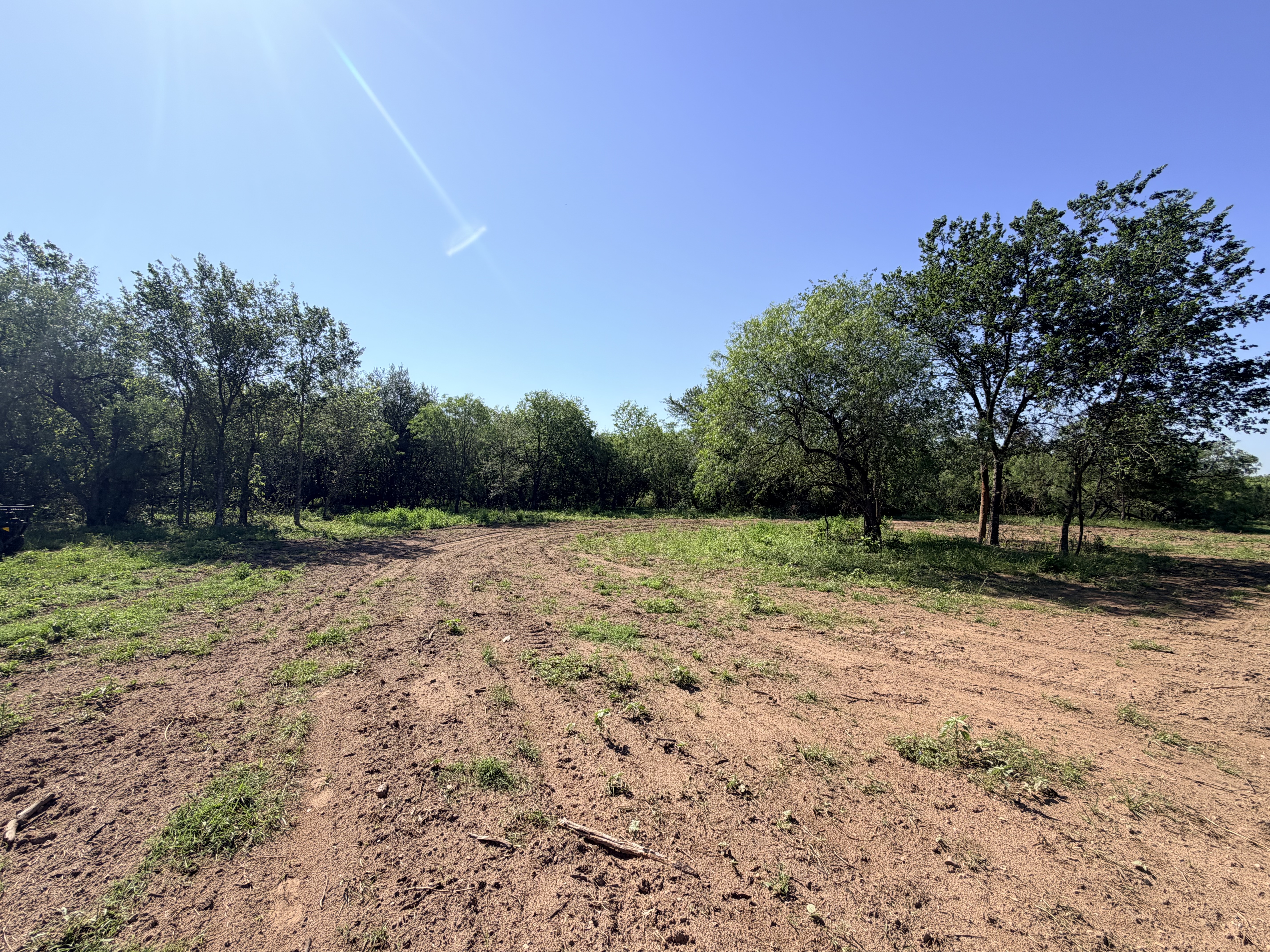 Discover a stunning piece of Central Texas landscape located in Luling, TX. This property offers over 12 acres of land, providing the perfect blend of country living and convenience. Enjoy the serene environment, just minutes from town, while experiencing true rural tranquility. The land boasts enormous shade trees and beautiful creek bottom terrain. Its gentle, sloping topography offers pristine views of the surrounding countryside, making it an ideal spot for those seeking scenic vistas. West Plum Creek runs along the backside of the property, adding to its natural appeal. The property features FM highway frontage, ensuring easy access. Several prime building sites are ready for development, with new fencing and electricity already installed. These improvements make the land immediately usable for various purposes. Situated within 5 minutes of Luling and just 10 minutes from Lockhart, this property provides quick access to nearby towns. It is less than an hour from both Austin and San Antonio, and only about 45 minutes from the Austin International Airport and Circuit of the Americas racetrack. 
NO RESTRICTIONS
AG EXEMPT - WILDLIFE